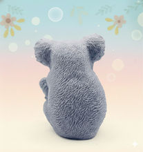 Load image into Gallery viewer, Handmade vegan soaps featuring a chunky koala bear climbing a tree packaged in beautiful eco friendly packaging crafted with natural French clays, activated charcoal and essential oils. a eco-friendly, zero waste gift that’s cruelty-free, skin-nourishing, and perfect for koala bear lovers and animal themed gifts. small business UK
