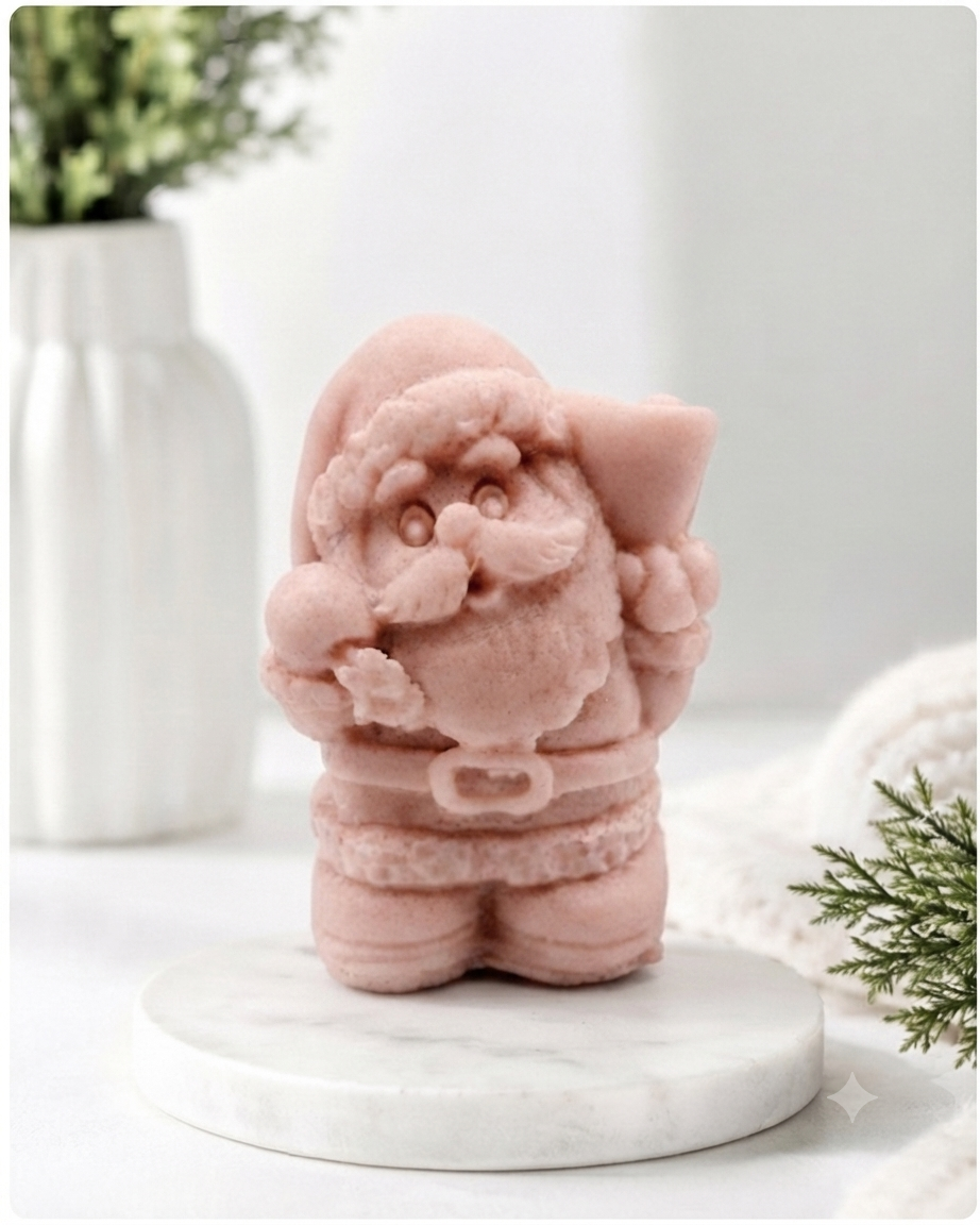 A highly detailed 3D handmade vegan soap featuring a Father Christmas carrying a large sack of gifts over his shoulder and holding a bell, featuring an intricate curly beard and fur-trimmed suit, set against a festive holiday background.