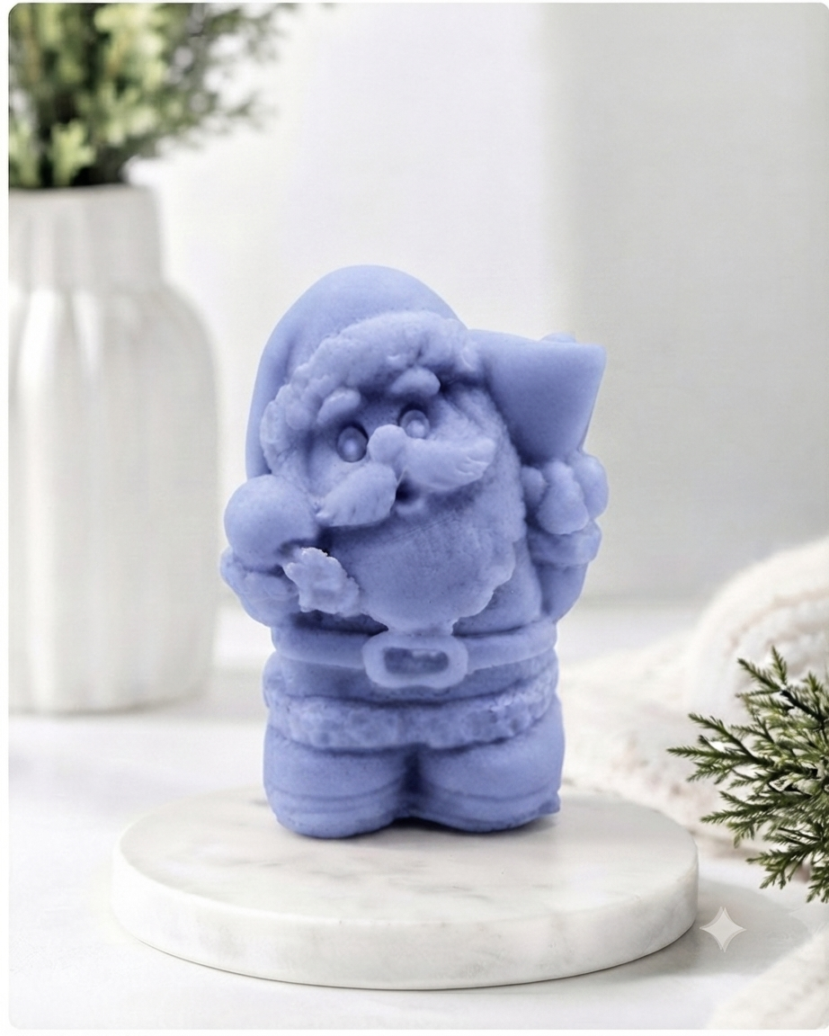 A highly detailed 3D handmade vegan soap featuring a Father Christmas carrying a large sack of gifts over his shoulder and holding a bell, featuring an intricate curly beard and fur-trimmed suit, set against a festive holiday background.