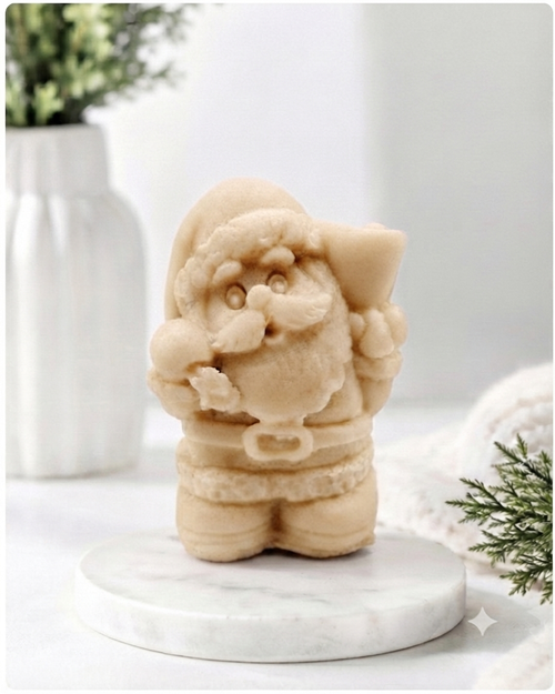 A highly detailed 3D handmade vegan soap featuring a Father Christmas carrying a large sack of gifts over his shoulder and holding a bell, featuring an intricate curly beard and fur-trimmed suit, set against a festive holiday background.