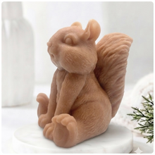 Load image into Gallery viewer, Handmade 3D squirrel-shaped soap sitting upright on a white marble display stand, featuring detailed textured fur and a bushy tail.
