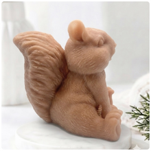 Load image into Gallery viewer, Handmade 3D squirrel-shaped soap sitting upright on a white marble display stand, featuring detailed textured fur and a bushy tail.
