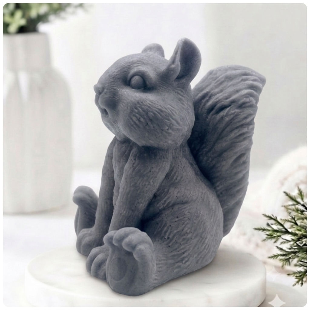 Handmade 3D squirrel-shaped soap sitting upright on a white marble display stand, featuring detailed textured fur and a bushy tail.