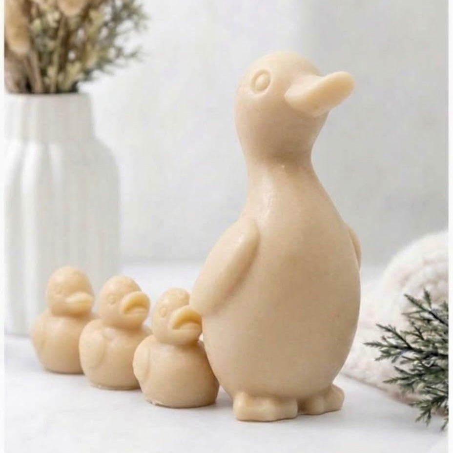 Artisan cruelty-free duck soap family walking in a line, showcasing handcrafted vegan bath products for kids and home decor.