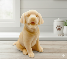 Load image into Gallery viewer, handmade vegan soap in the shape of a realistic sitting Labrador puppy with its mouth open and tongue out, displayed on a rustic wooden table in a bright farmhouse decor kitchen.
