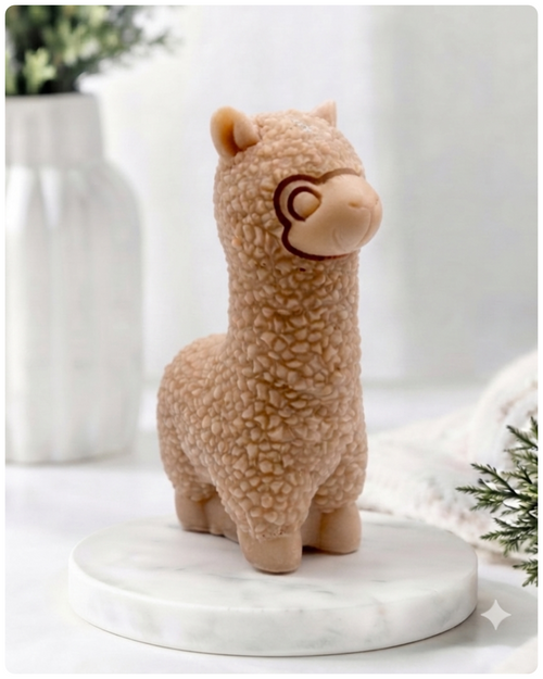 handmade vegan soap in the shape of a realistic standing alpaca sculpture, featuring detailed curly wool texture and a smiling face, displayed on a rustic white wooden surface in a bright farmhouse decor setting.