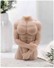 Load image into Gallery viewer, A highly detailed handmade vegan soap in the shape of a muscular male torso, featuring a detailed sculptural design, displayed against a whimsical background for a sophisticated farmhouse decor touch.
