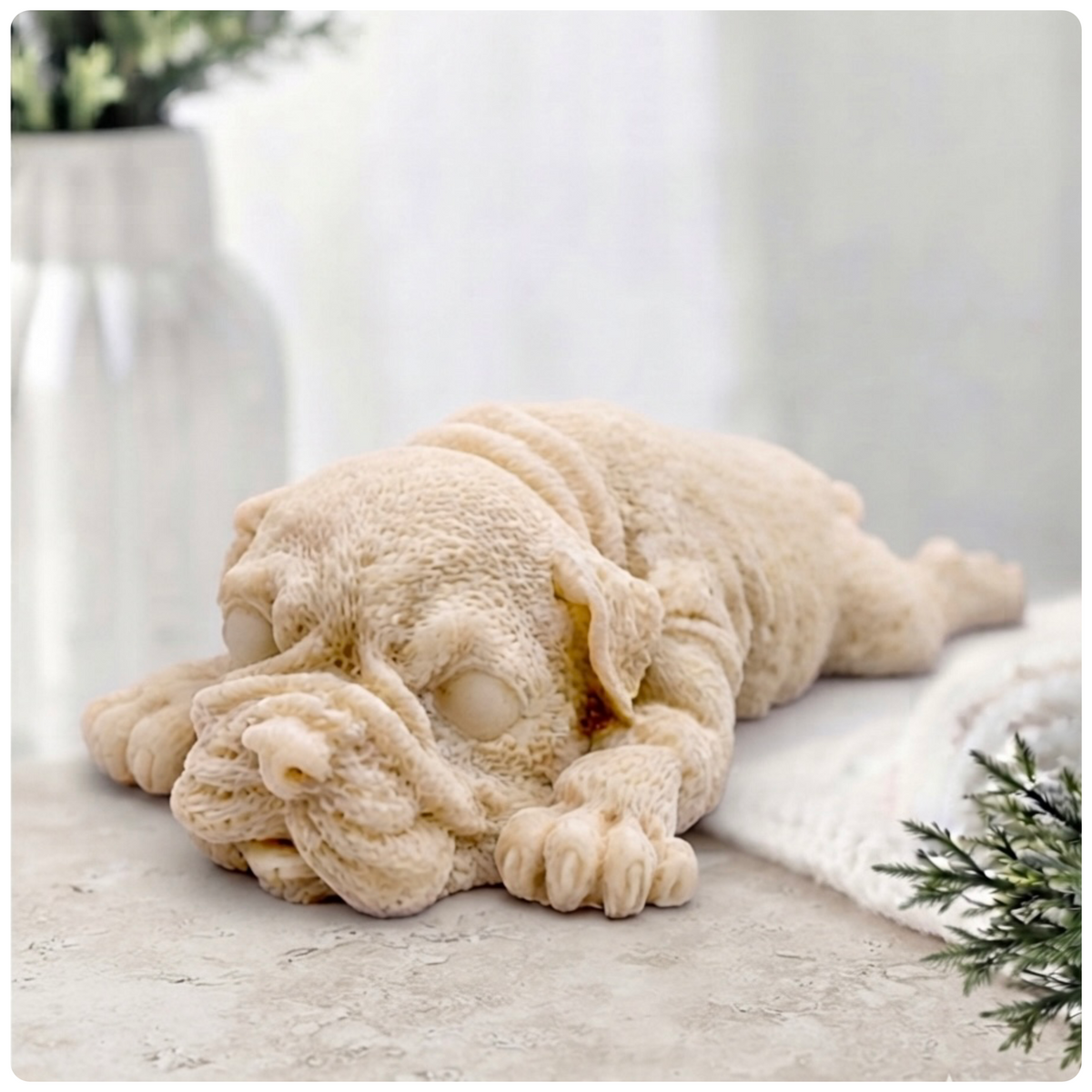A highly detailed handmade vegan soap gift sculpted in the shape of a Shar Pei puppy lying flat on its stomach with its head resting on its paws, featuring realistic deep skin folds and wrinkles. Handmade in Blackpool 