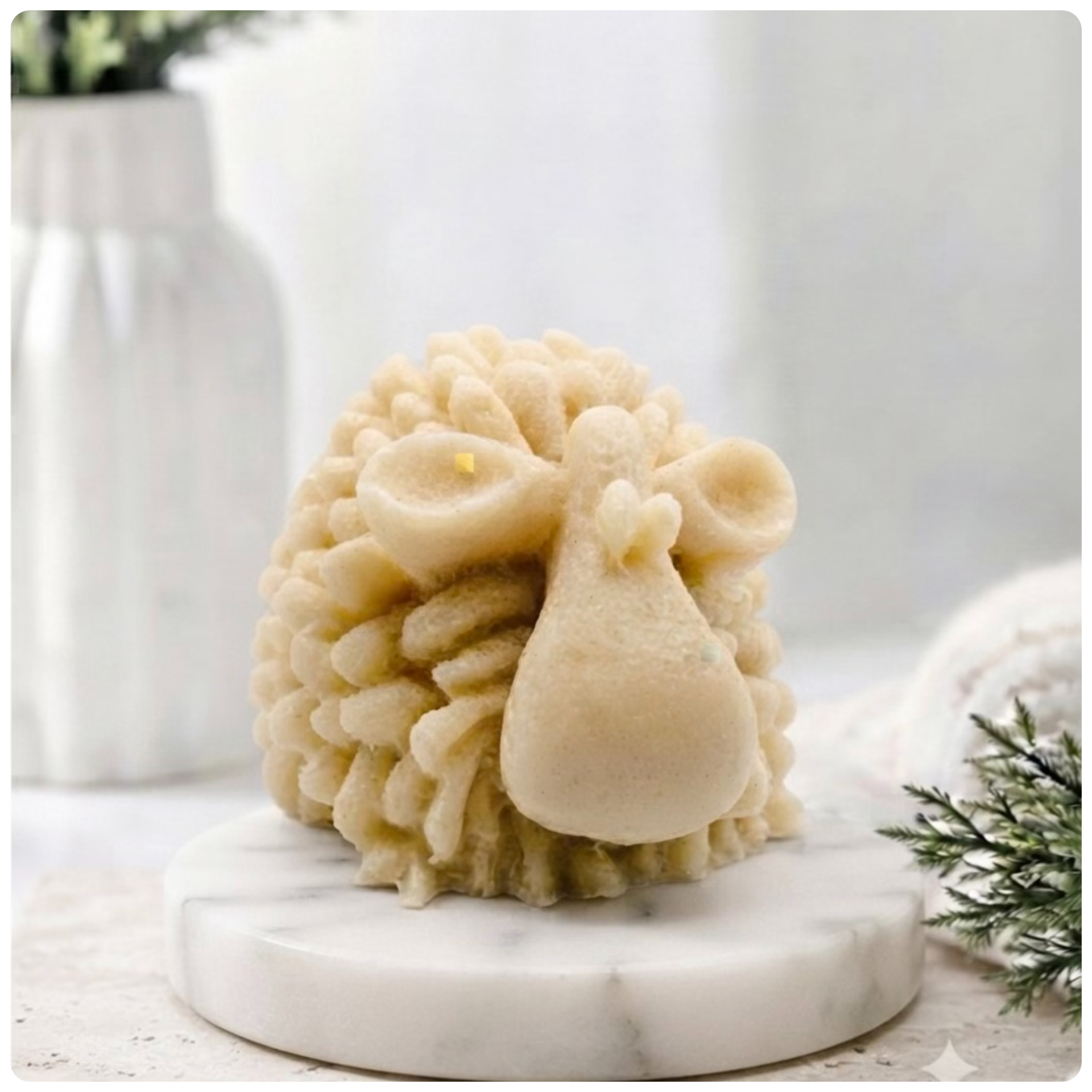 A highly detailed handmade vegan soap sculpted in the shape of a fluffy sheep with thick, textured wool and a smooth face, displayed on a light wooden surface in a farmhouse-style setting.