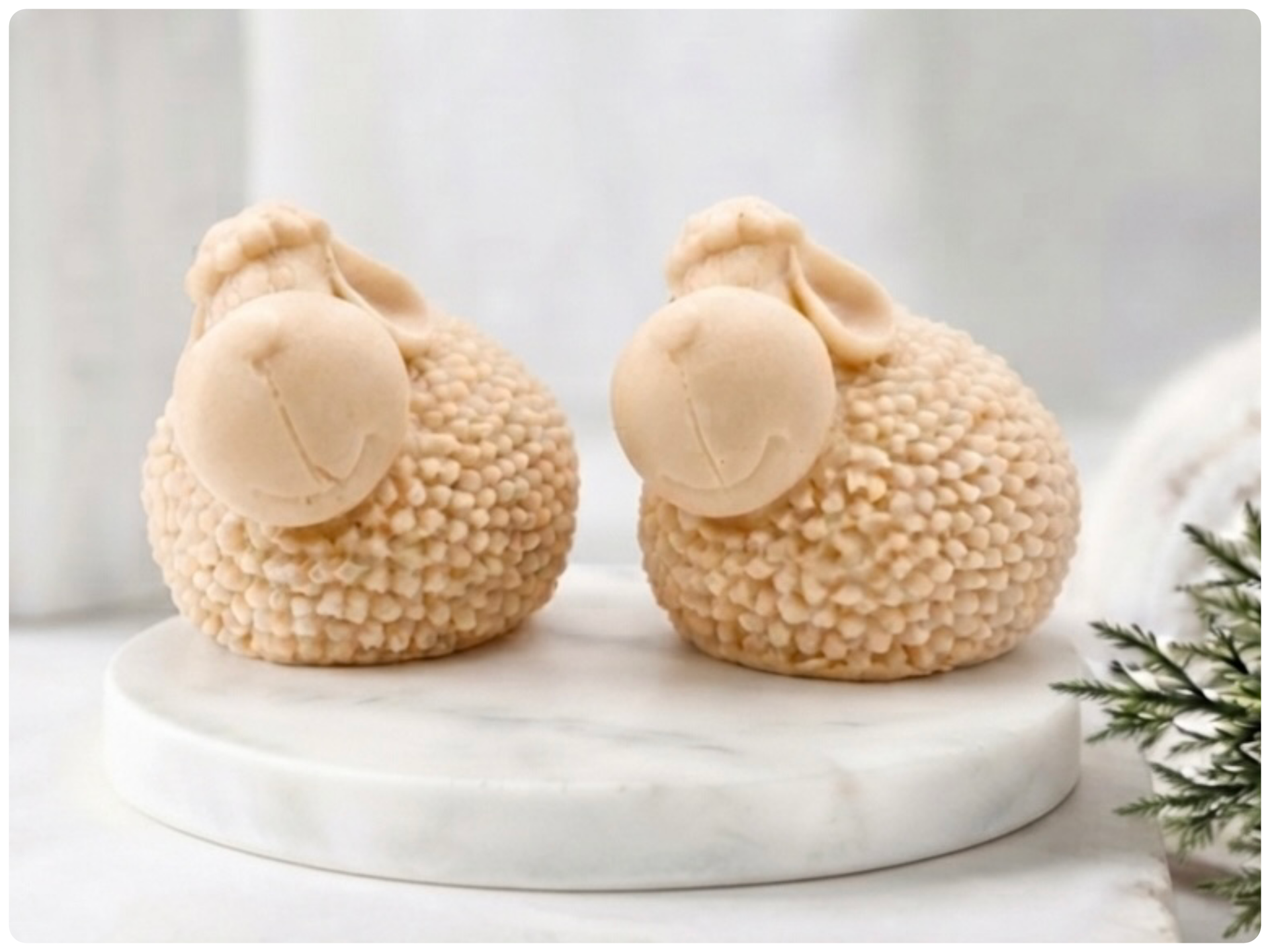 Two handmade vegan soap gift set featuring two fluffy spring lambs with detailed wool texture, displayed on a weathered white wooden surface in a bright farmhouse decor room