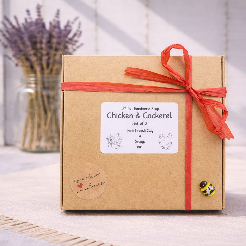 Gift box with a red ribbon and a label on a light wooden surface.