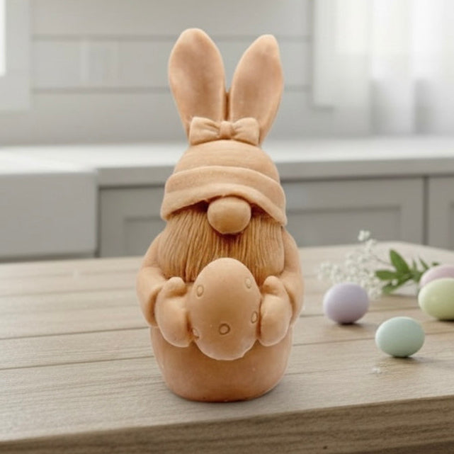 Handmade vegan soaps featuring a gorgeous gnome with easter bunny ears, holding his easter egg packaged in beautiful eco friendly packaging. 