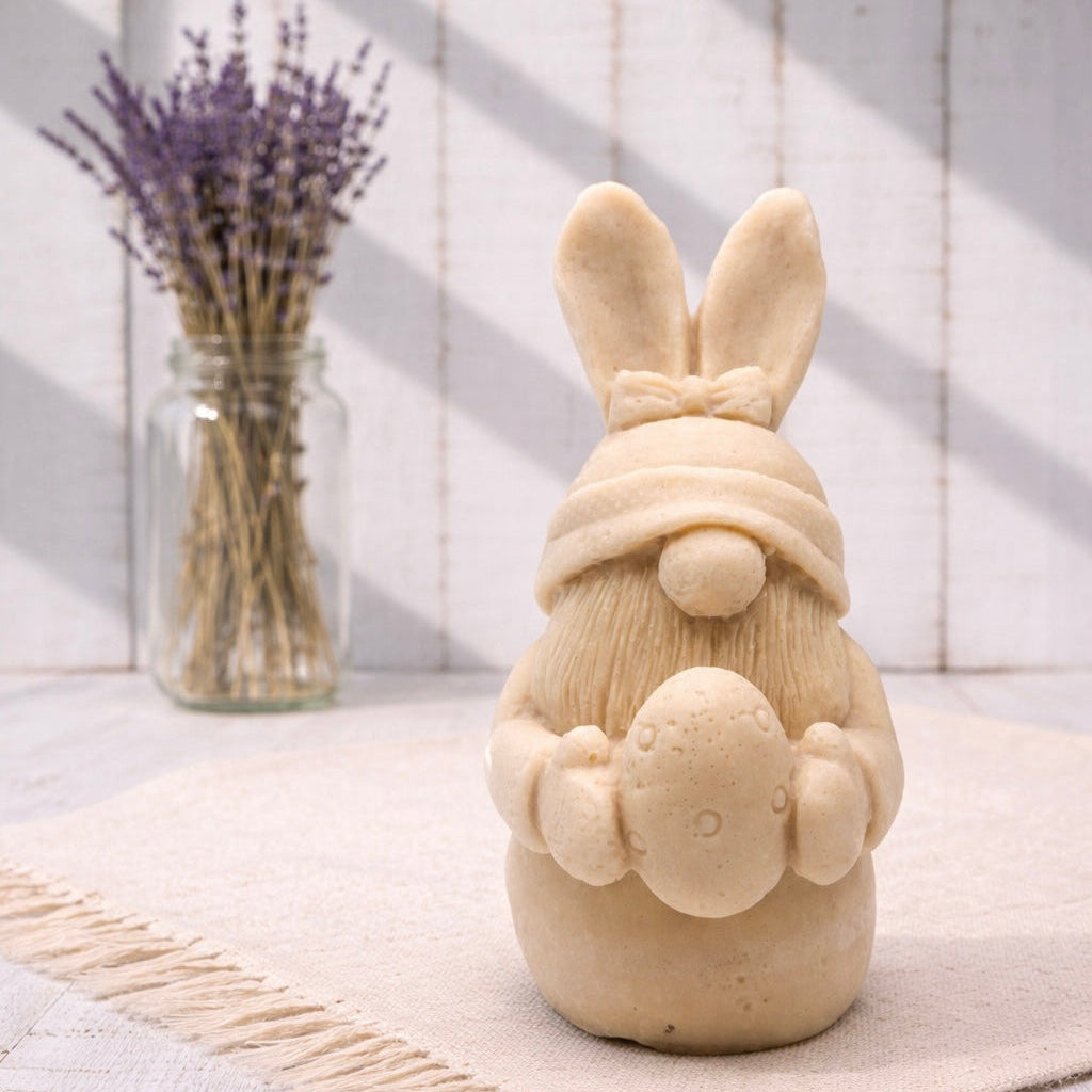 Handmade vegan soaps featuring a gorgeous gnome with easter bunny ears, holding his easter egg packaged in beautiful eco friendly packaging. 