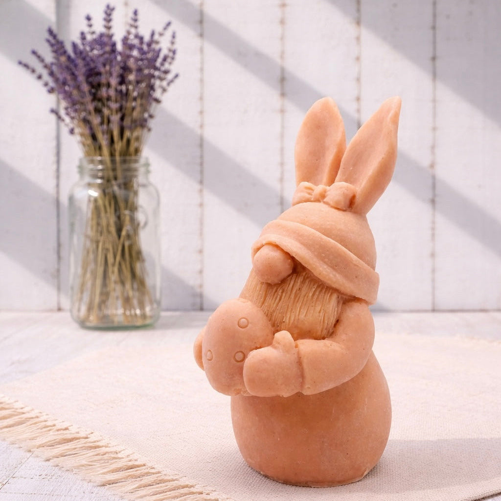 Handmade vegan soaps featuring a gorgeous gnome with easter bunny ears, holding his easter egg packaged in beautiful eco friendly packaging. 