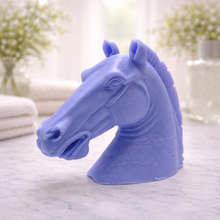 Load image into Gallery viewer, A beautiful handmade vegan soap in the shape of a realistic horse head sculpture, featuring detailed muscular definition and a flowing mane, set against a whimsical farmhouse decor background
