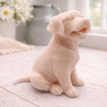 handmade vegan soap in the shape of a happy sitting Labrador retriever puppy sculpture with its tongue out, displayed in a bright farmhouse decor setting.
