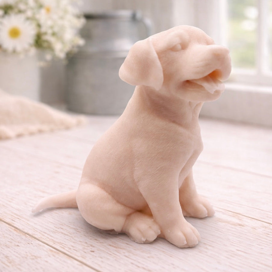 handmade vegan soap in the shape of a happy sitting Labrador retriever puppy sculpture with its tongue out, displayed in a bright farmhouse decor setting.