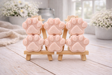 Load image into Gallery viewer, Pink paw-shaped vegan soap gift set on wooden stands with a blurred indoor background
