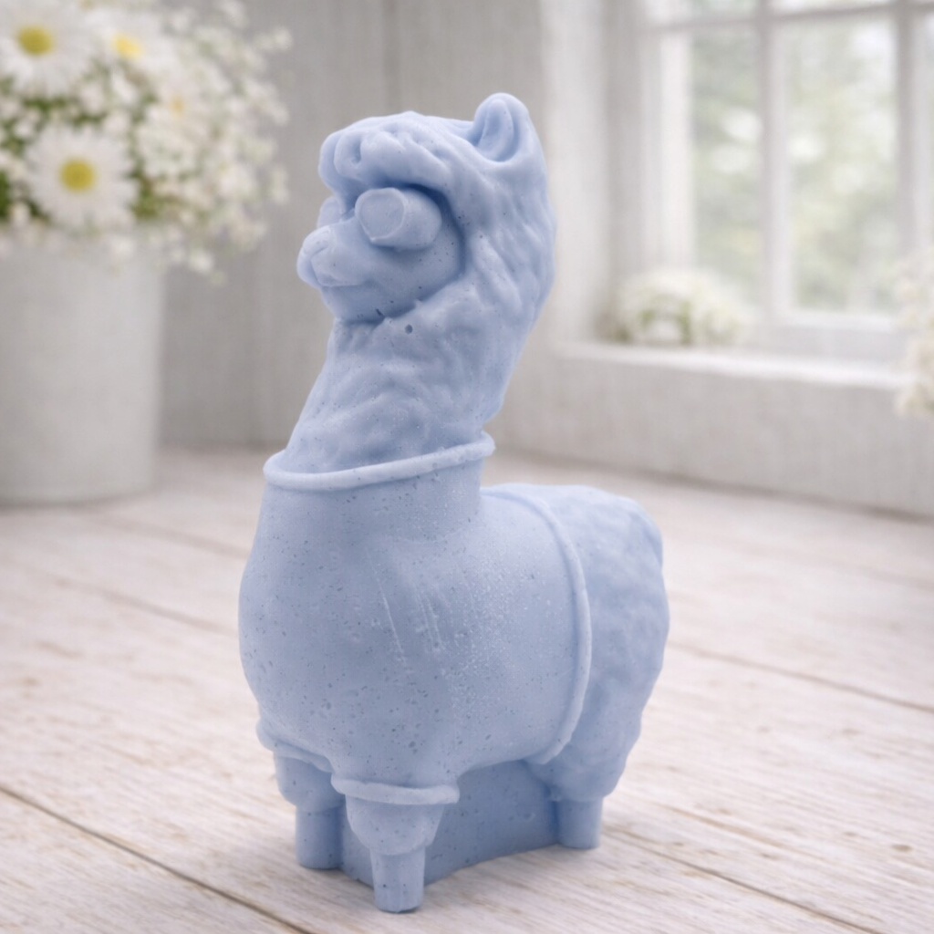 handmade vegan soap in the shape of a realistic standing alpaca or llama sculpture, featuring a smooth body with detailed fur texture on the head and neck, displayed in a bright farmhouse decor setting.