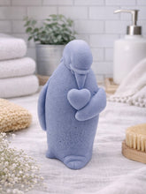 Load image into Gallery viewer, handmade vegan soap in the shape of a realistic penguin sculpture holding a small heart to its chest,
