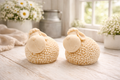 Two handmade vegan soaps in the shape of fluffy spring lambs with detailed wool texture, displayed on a weathered white wooden surface in a bright farmhouse decor room
