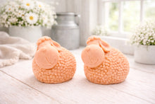 Load image into Gallery viewer, Two handmade vegan soap gift set featuring two fluffy spring lambs with detailed wool texture, displayed on a weathered white wooden surface in a bright farmhouse decor room
