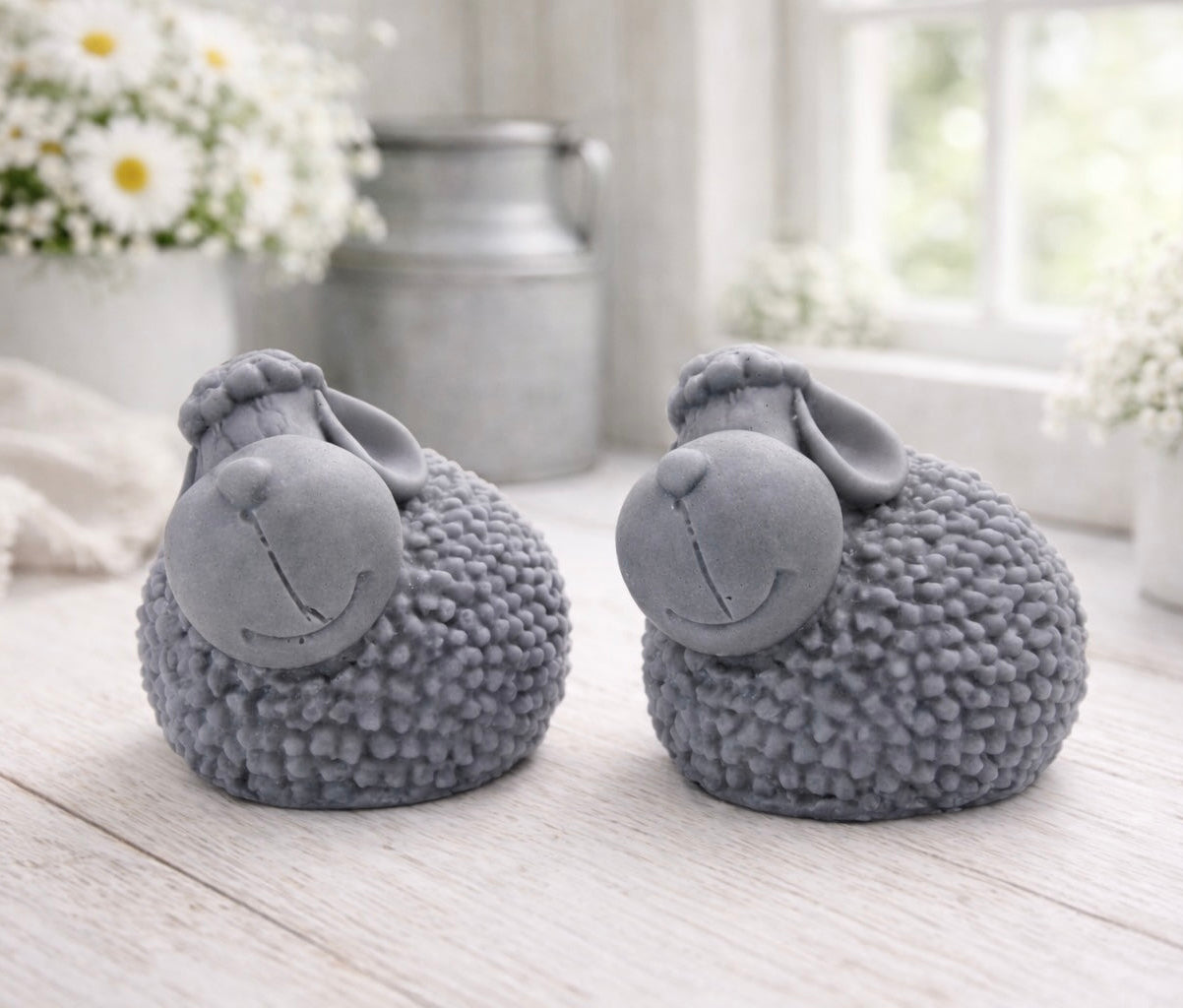 Two handmade vegan soap gift set featuring two fluffy spring lambs with detailed wool texture, displayed on a weathered white wooden surface in a bright farmhouse decor room