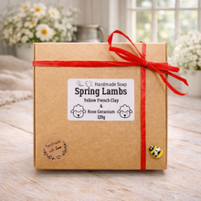 Load image into Gallery viewer, Handmade soap packaging with a red ribbon on a wooden surface

