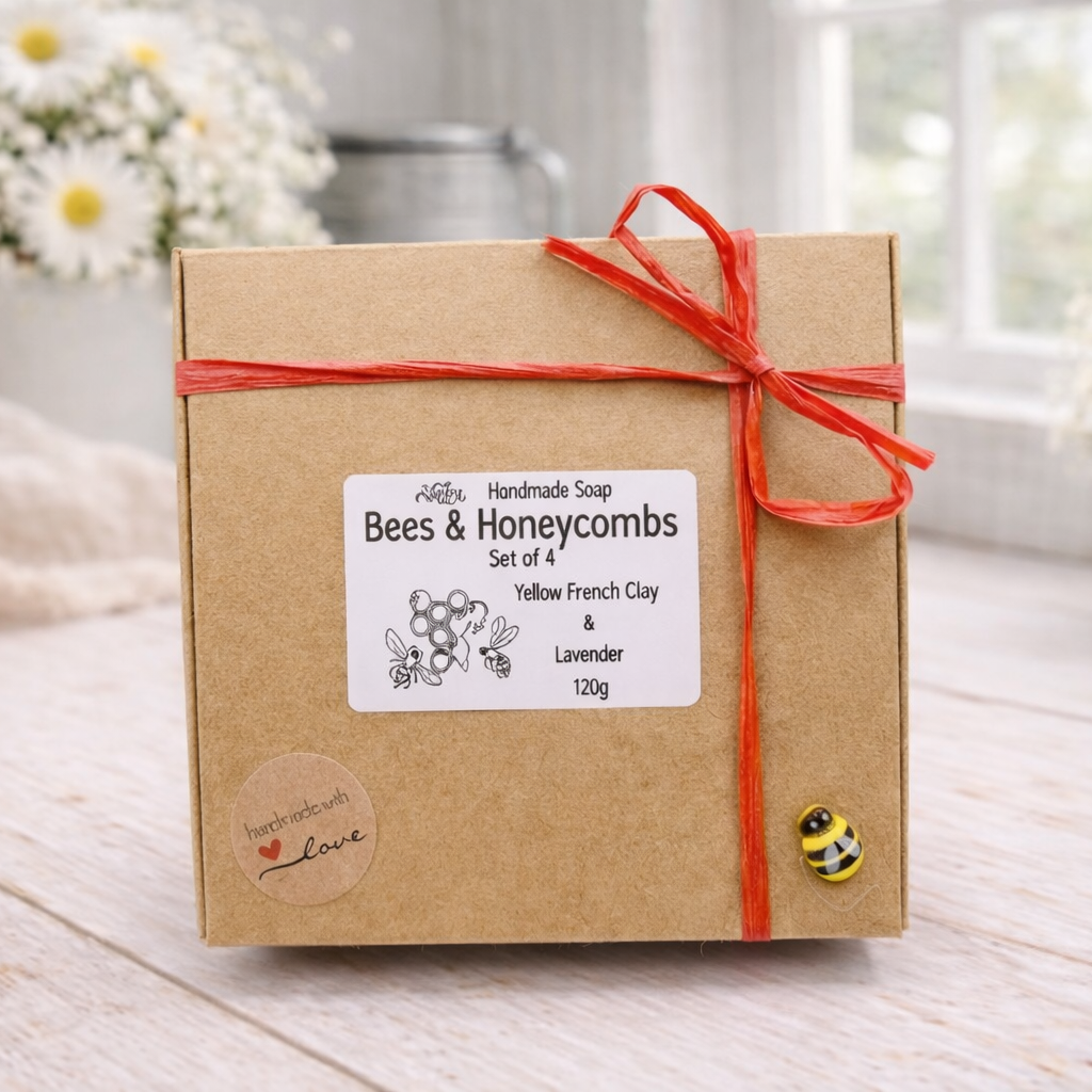 Kraft paper box with a red ribbon and 'Bees & Honeycombs' label on a wooden surface.