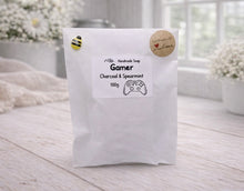 Load image into Gallery viewer, White soap packaging with a label on a light wooden surface
