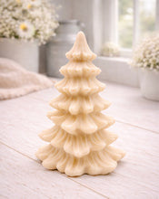 Load image into Gallery viewer, vegan soap sculpted into a realistic evergreen Christmas tree with multiple layers of textured, needle-like branches, with a subtle snow-dusted effect.
