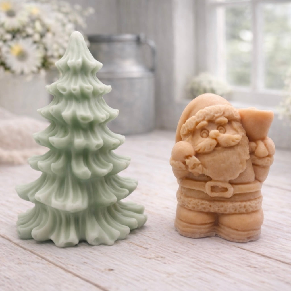 A duo of handmade vegan soaps featuring a Father Christmas figure with standing next to a mint-green tiered 3D Christmas tree, displayed in a bright farmhouse setting.