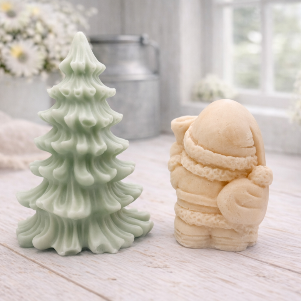 A duo of handmade vegan soaps featuring a Father Christmas figure with standing next to a mint-green tiered 3D Christmas tree, displayed in a bright farmhouse setting.