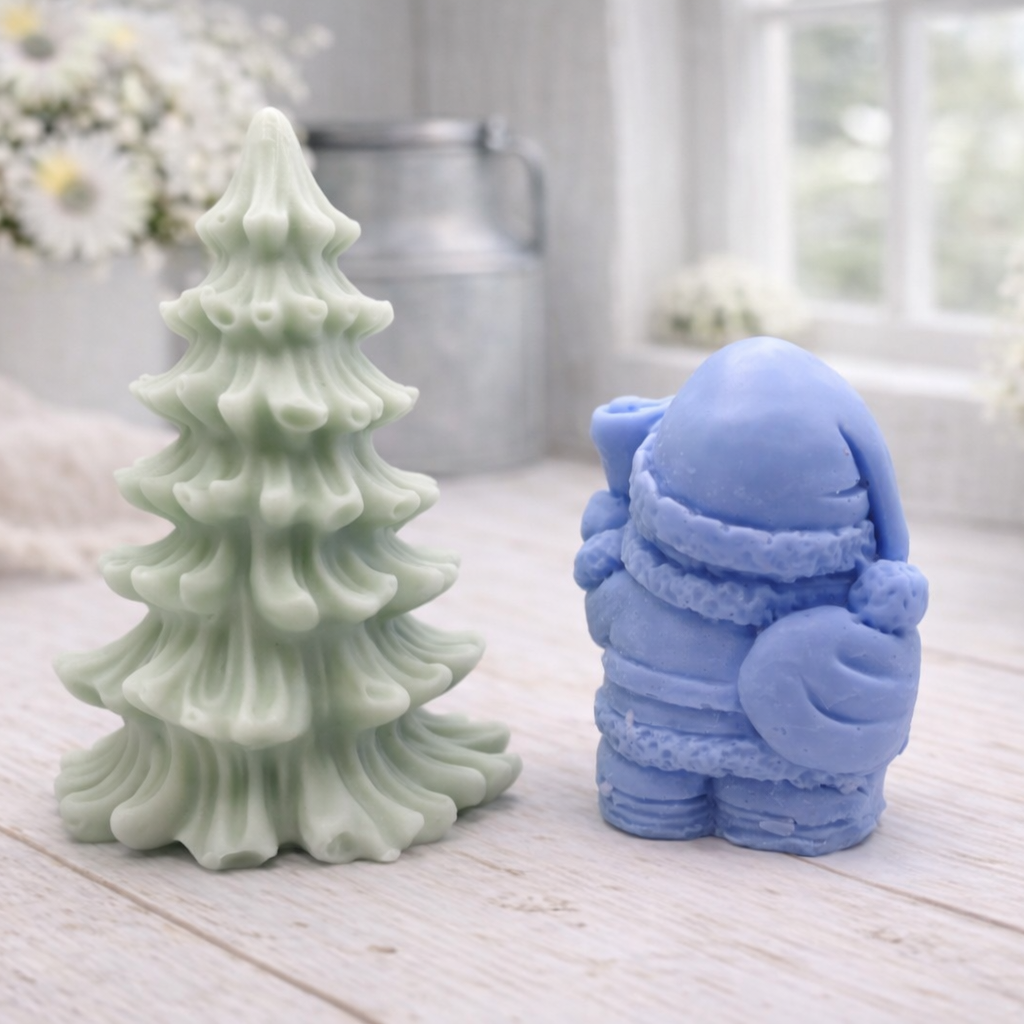 A duo of handmade vegan soaps featuring a Father Christmas figure with standing next to a mint-green tiered 3D Christmas tree, displayed in a bright farmhouse setting.