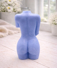 Load image into Gallery viewer, A 3D handmade vegan soap sculpted into a detailed female torso with soft, realistic curves and defined musculature and displayed in a bright farmhouse setting.
