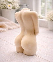 Load image into Gallery viewer, A 3D handmade vegan soap sculpted into a detailed female torso with soft, realistic curves and defined musculature and displayed in a bright farmhouse setting.
