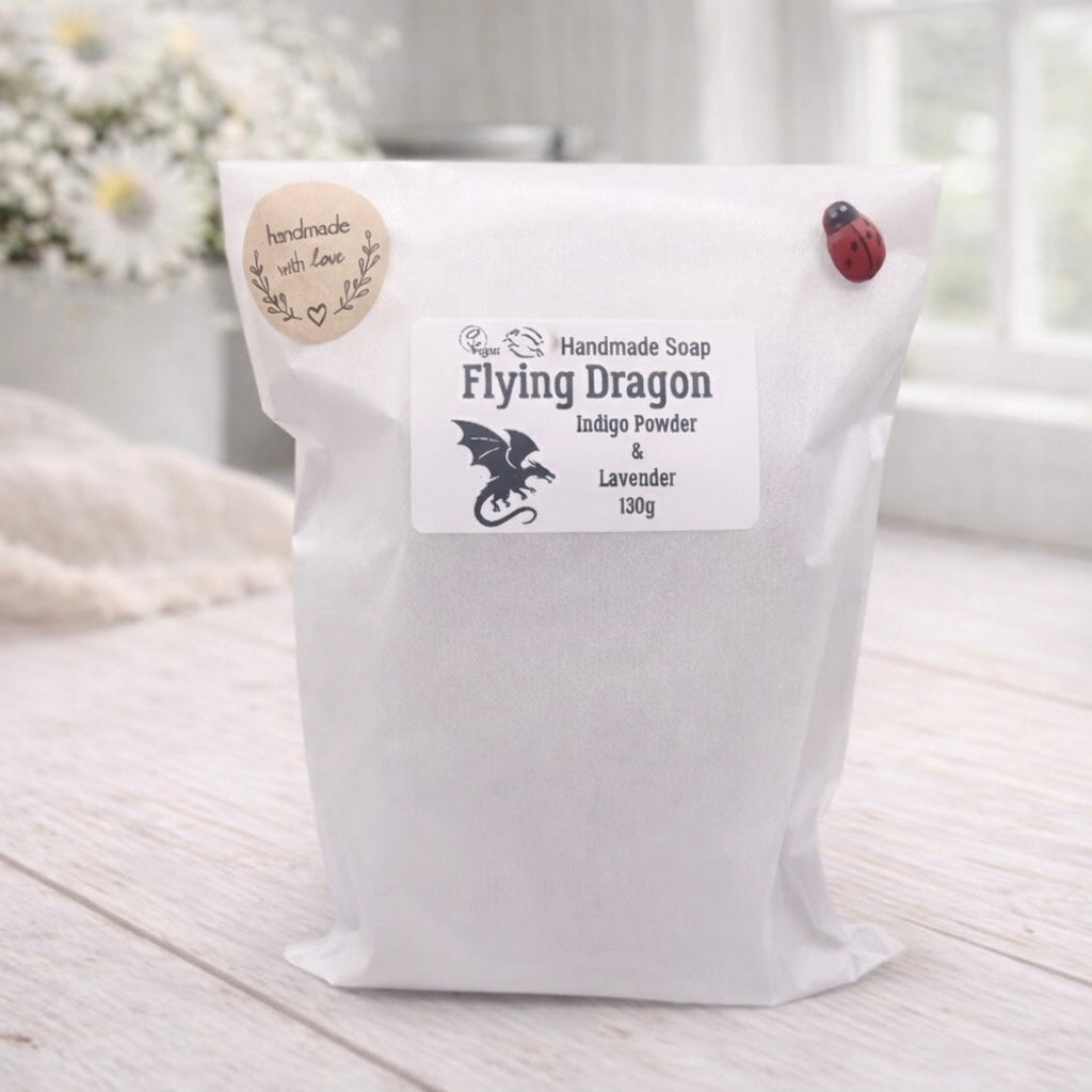White bag labeled 'Flying Dragon' with a dragon design on a light wooden surface.