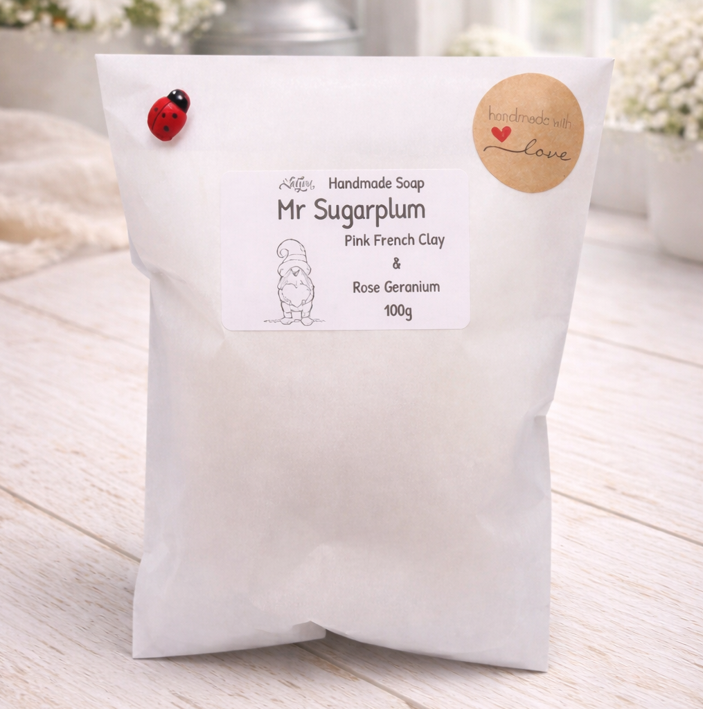 Handmade soap packaging with branding on a wooden surface