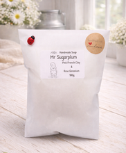 Load image into Gallery viewer, Handmade soap packaging with branding on a wooden surface
