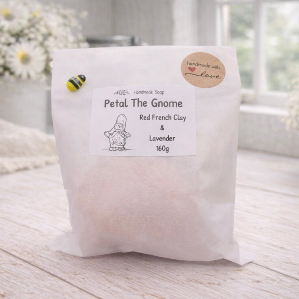 White bag labeled 'Petal The Gnome' with a gnome illustration on a light wooden surface.