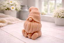 Load image into Gallery viewer, A handmade vegan soap in a natural tone, sculpted as a gnome (gonk) with a tall, curved hat that covers the eyes and has clouds on it, a round nose, and a long, textured beard.
