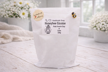 Load image into Gallery viewer, Handmade soap packaging with 'Honeybee Gnome' branding on a light wooden surface.
