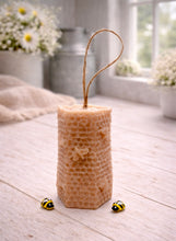 Load image into Gallery viewer, A tall, rectangular handmade vegan soap with a detailed honeycomb texture on all sides and small embossed bees, featuring a natural twine hanging rope, displayed upright on a light wooden surface.
