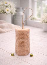 Load image into Gallery viewer, A tall, rectangular handmade vegan soap with a detailed honeycomb texture on all sides and small embossed bees, featuring a natural twine hanging rope, displayed upright on a light wooden surface.
