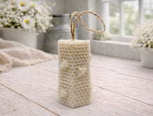 Load image into Gallery viewer, A tall, rectangular handmade vegan soap with a detailed honeycomb texture on all sides and small embossed bees, featuring a natural twine hanging rope, displayed upright on a light wooden surface.
