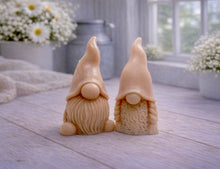 Load image into Gallery viewer, A pair of handmade vegan soaps, featuring a Mr and Mrs Gnome (gonk) set; one with a full textured beard and the other with thick braided plaits, both wearing tall, pointed hats. Gift boxed. 

