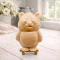 Handmade vegan soap sculpted in the shape of a round, sitting panda bear with detailed fur textures and a friendly expression, displayed on a small wooden easel.