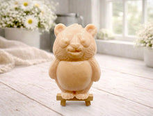 Load image into Gallery viewer, Handmade vegan soap sculpted in the shape of a round, sitting panda bear with detailed fur textures and a friendly expression, displayed on a small wooden easel.
