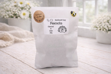 Load image into Gallery viewer, Handmade soap package with a label on a wooden surface
