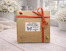 Load image into Gallery viewer, Box of Positivity Soaps with a red ribbon on a wooden surface
